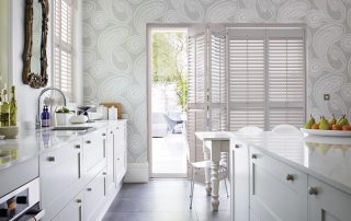 Wooden shutters in a white bathroom in Tunbridge Wells