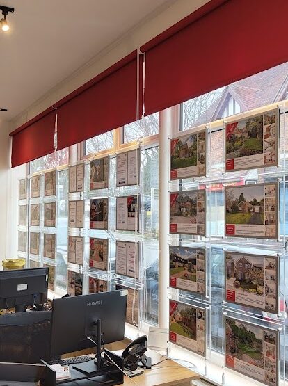 Red roller blinds for an Estate Agents in Crowborough